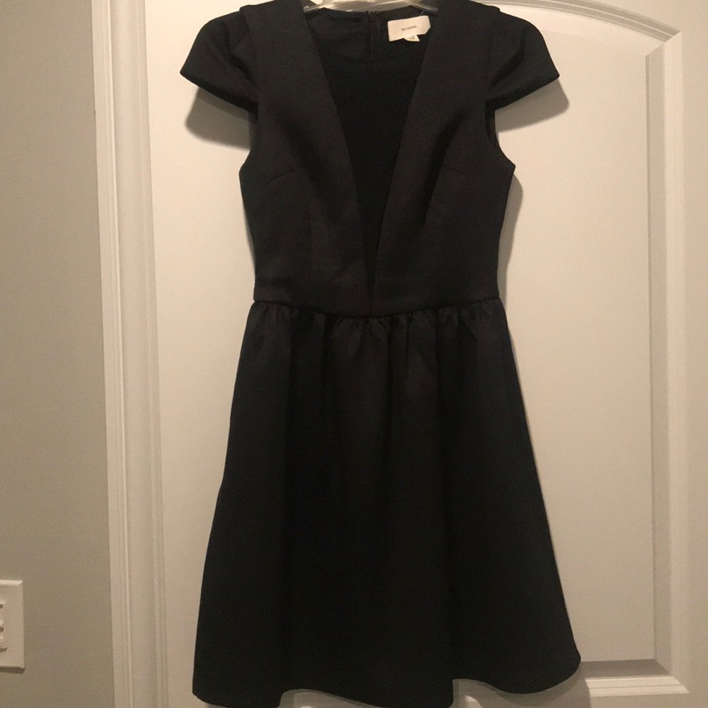 Short black party dress with textured fabric